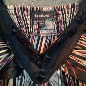 Bebe Vibrant Striped Top with Black Accents